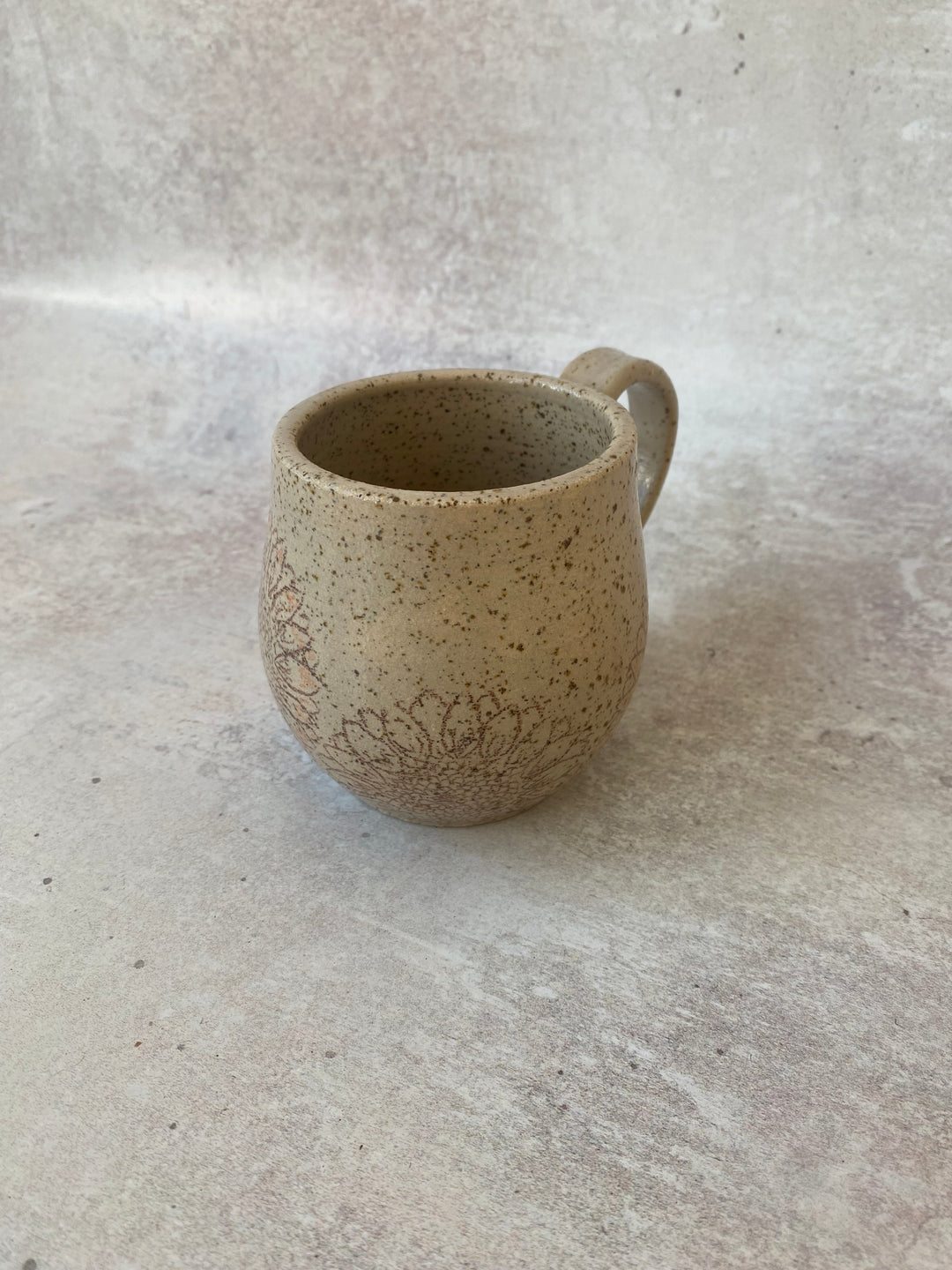 Handmade speckled clay sunflower ceramic mug with hourglass shape hand thrown in Shropshire UK