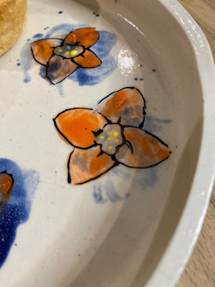 Set of 4 hand orange/blue flower hand painted plates